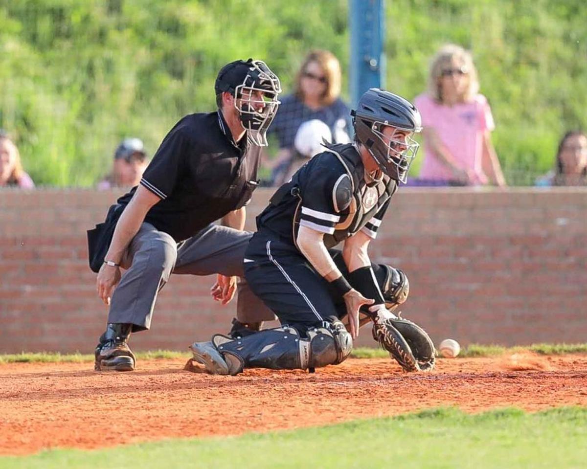 Hough catcher Justin Wilkins blocks the pitch and keeps Lake Norman base runners on 1st and 3rd from advancing. Hough would face the number 1 seed Lake Norman Wildcats in the 4A I-Meck Tournament Championship.