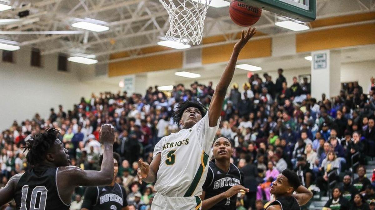 Independence's Andra’ McKee puts back an offensive rebound for two points. McKee, Jamarius Burton, Matthew Smith and Jordan Mobley sparked the Patriots to a 78-70 over rival Butler on Friday night.