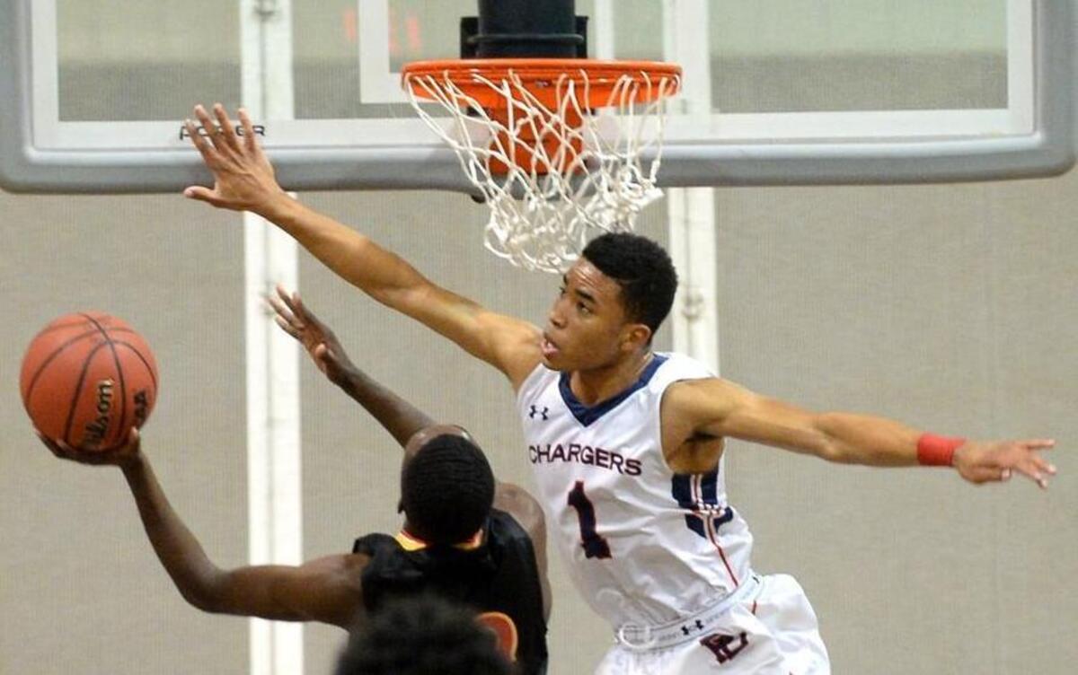 Providence Day's Devon Dotson, right, is the CISAA player of the year