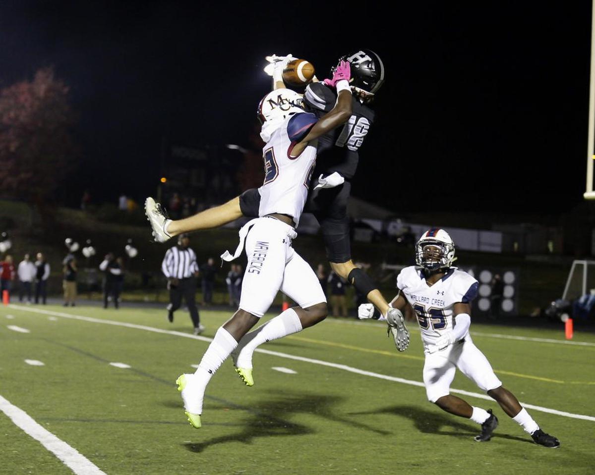 Mallard Creek free Safety Jaidyn Denis breaks up the pass in the first half of Friday’s game with Hough