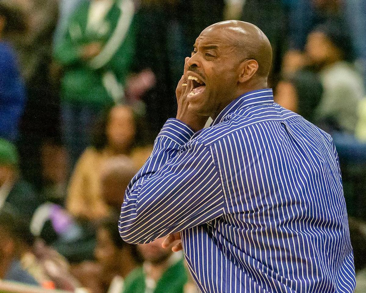 Olympic High coach Baronton Terry urges his team to play defense in Tuesday’s game at Independence.