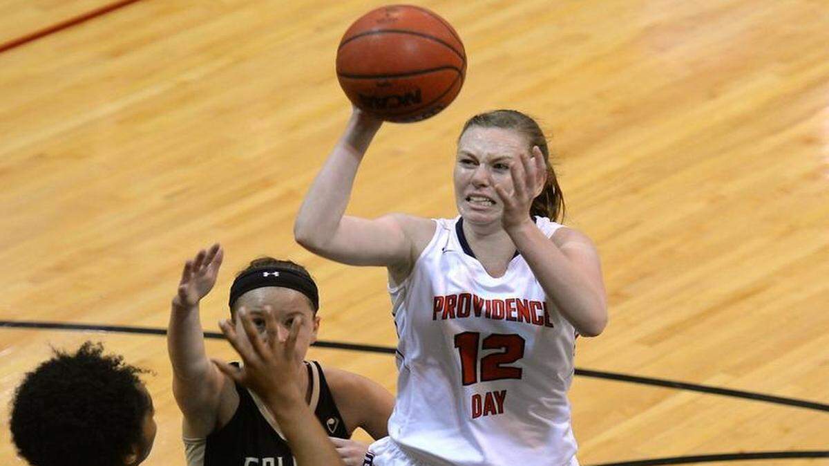 Providence Day's Erin Whalen, right, drives into the lane for a shot over the Forest Trail Academy defense during first half action at Providence Day School on Monday, January 18, 2016.