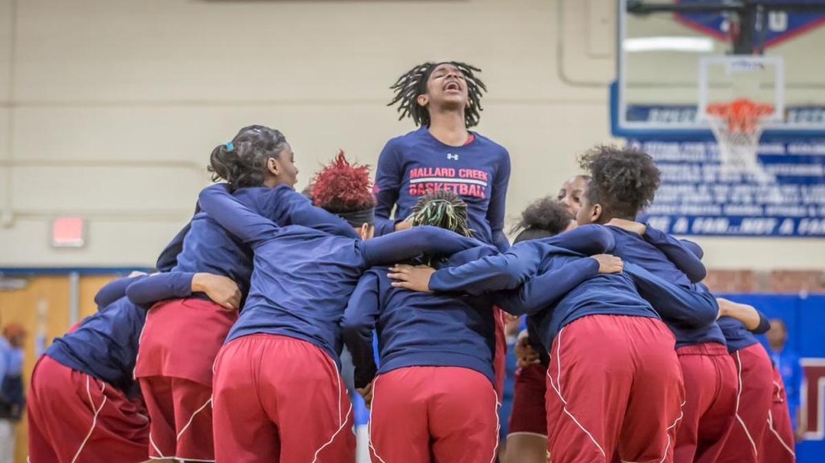 Mallard Creek’s Janay Sanders, a LaSalle recruit, leaps above her huddled teammates. Sanders and Mallard Creek begin the season No. 1 in the Observer’S Sweet 16 poll.