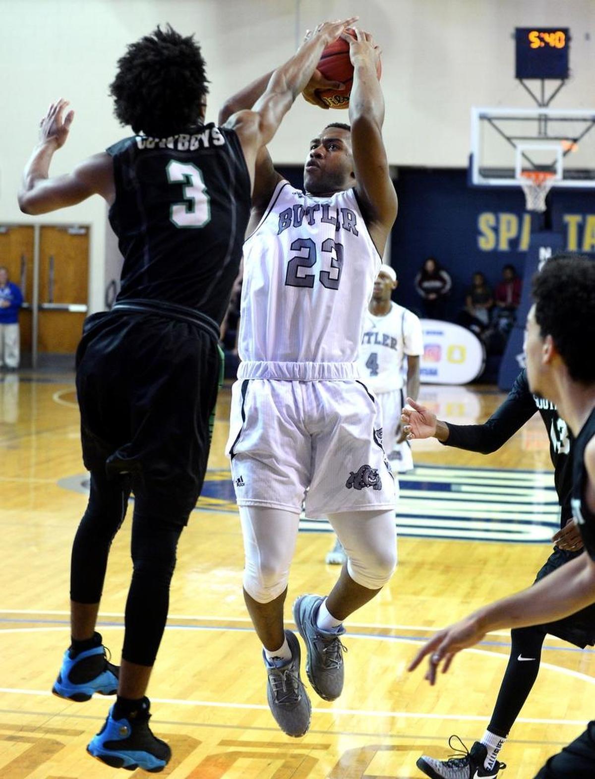 Butler Bulldogs D.J. Little, right, is among the Charlotte Observer’s high school basketball players of the week