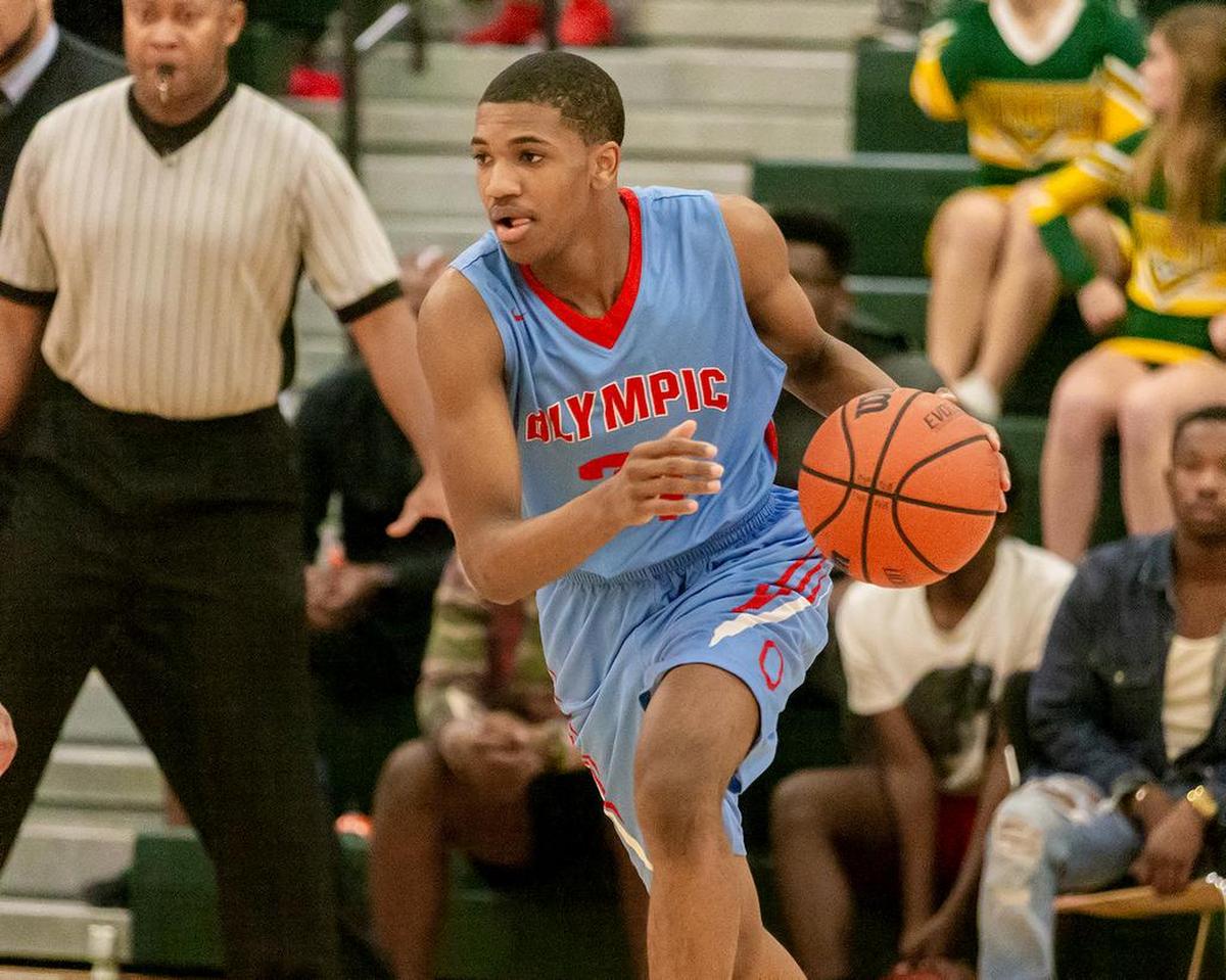 An Olympic player drives to the basket at Independence Tuesday.