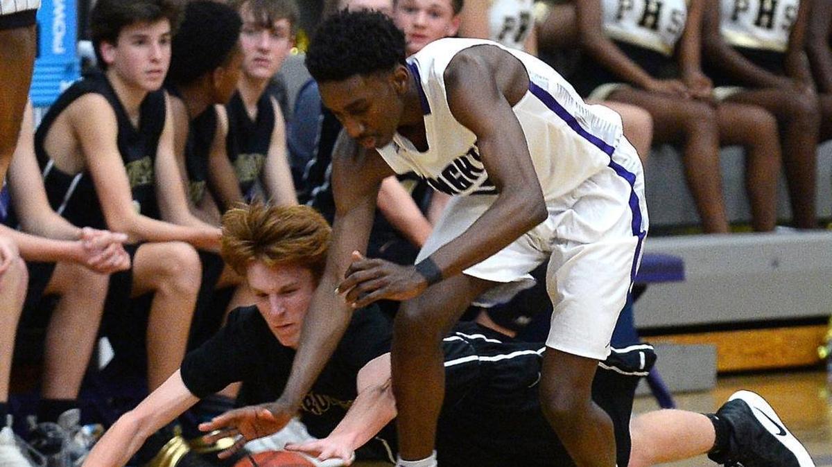 Ardrey Kell's David Kasanganay, right, led his team to a season-opening win with a career-high 29 points Tuesday