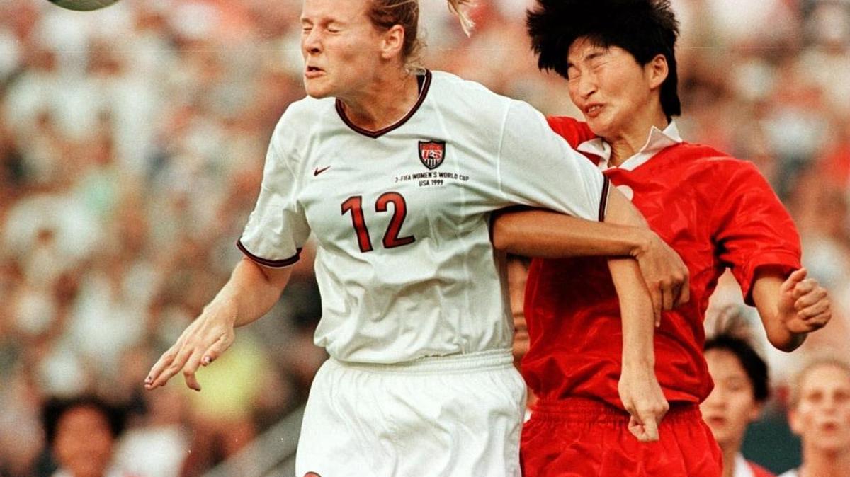 
In a 1999 women’s World Cup match against North Korea, Cindy Parlow Cone battles for a header. Parlow left soccer after a second concussion.
