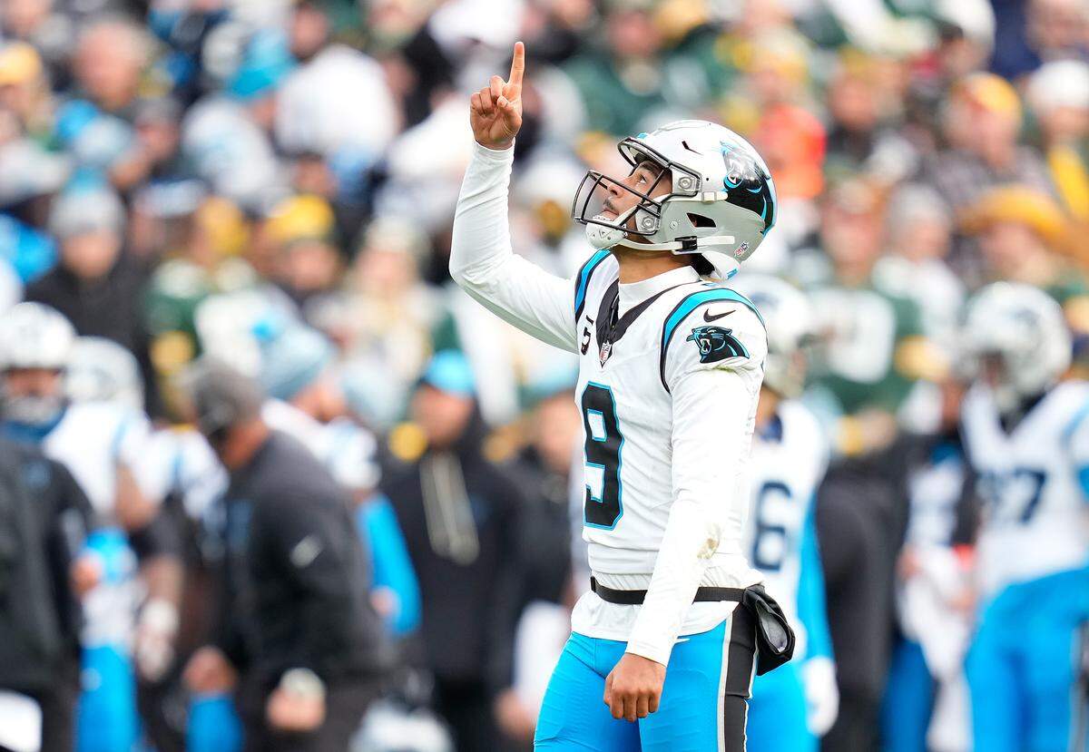 Bryce Young of the Carolina Panthers celebrates a touchdown in the third quarter against the Green Bay Packers on Sunday at Lambeau Field.