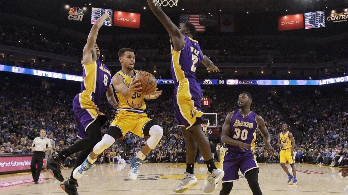 Golden State Warriors point guard Stephen Curry, center, was the NBA’s MVP last season with a dazzling display of skills.