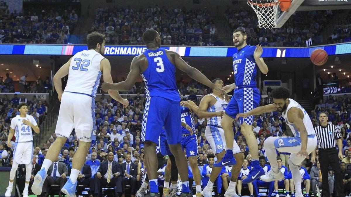 North Carolina's Joel Berry II (2) lands on the ground after shooting the ball as Kentucky's Isaac Humphries (15) guards him during the first half of UNC's game against Kentucky in the NCAA Tournament South Regional final at FedExForum in Memphis, TN Sunday, March 26, 2017. Berry would lie on the floor and then leave the game after the play but returned.