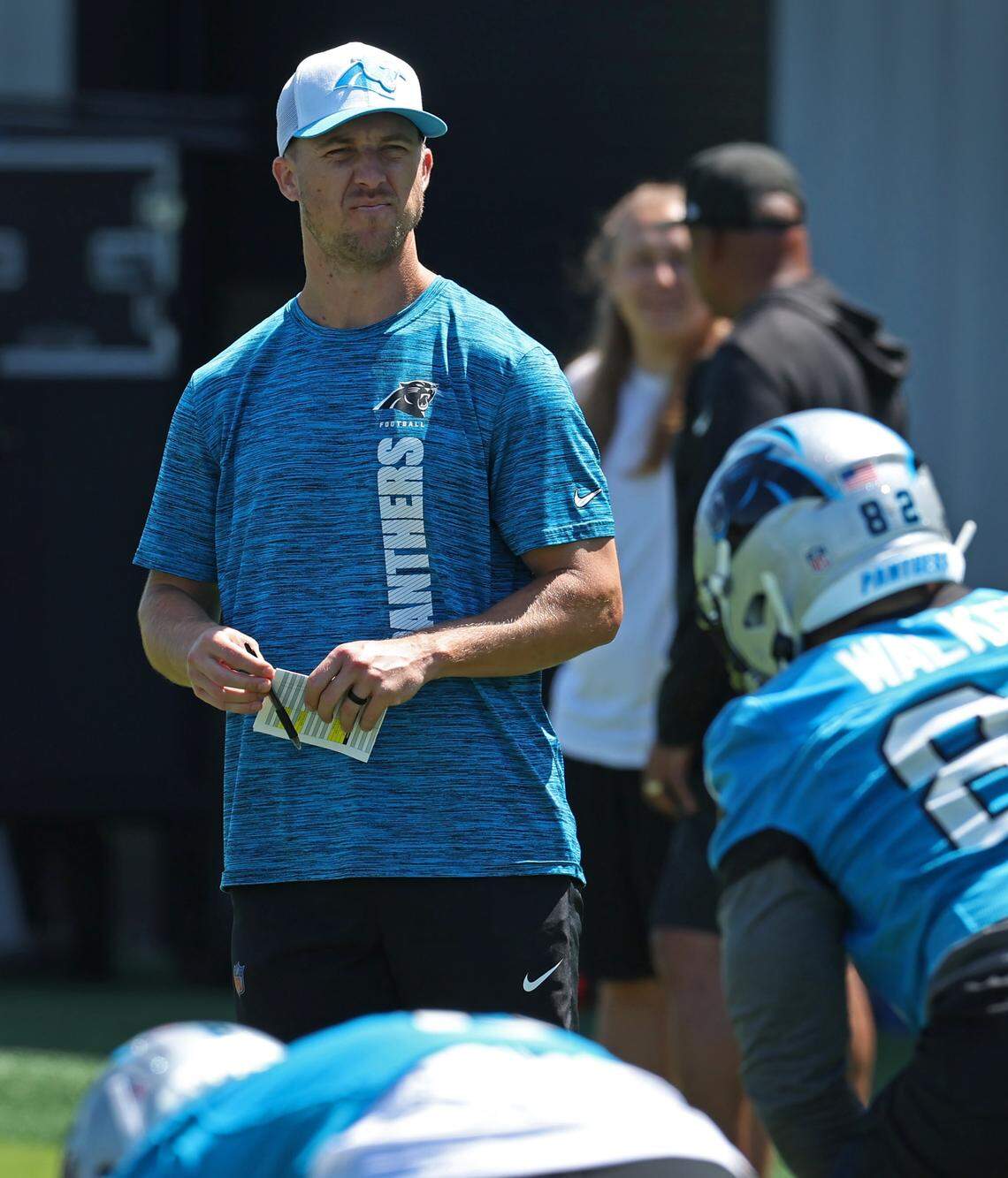 Carolina Panthers offensive coordinator Brad Idzik watches drills during 2025 rookie minicamp.