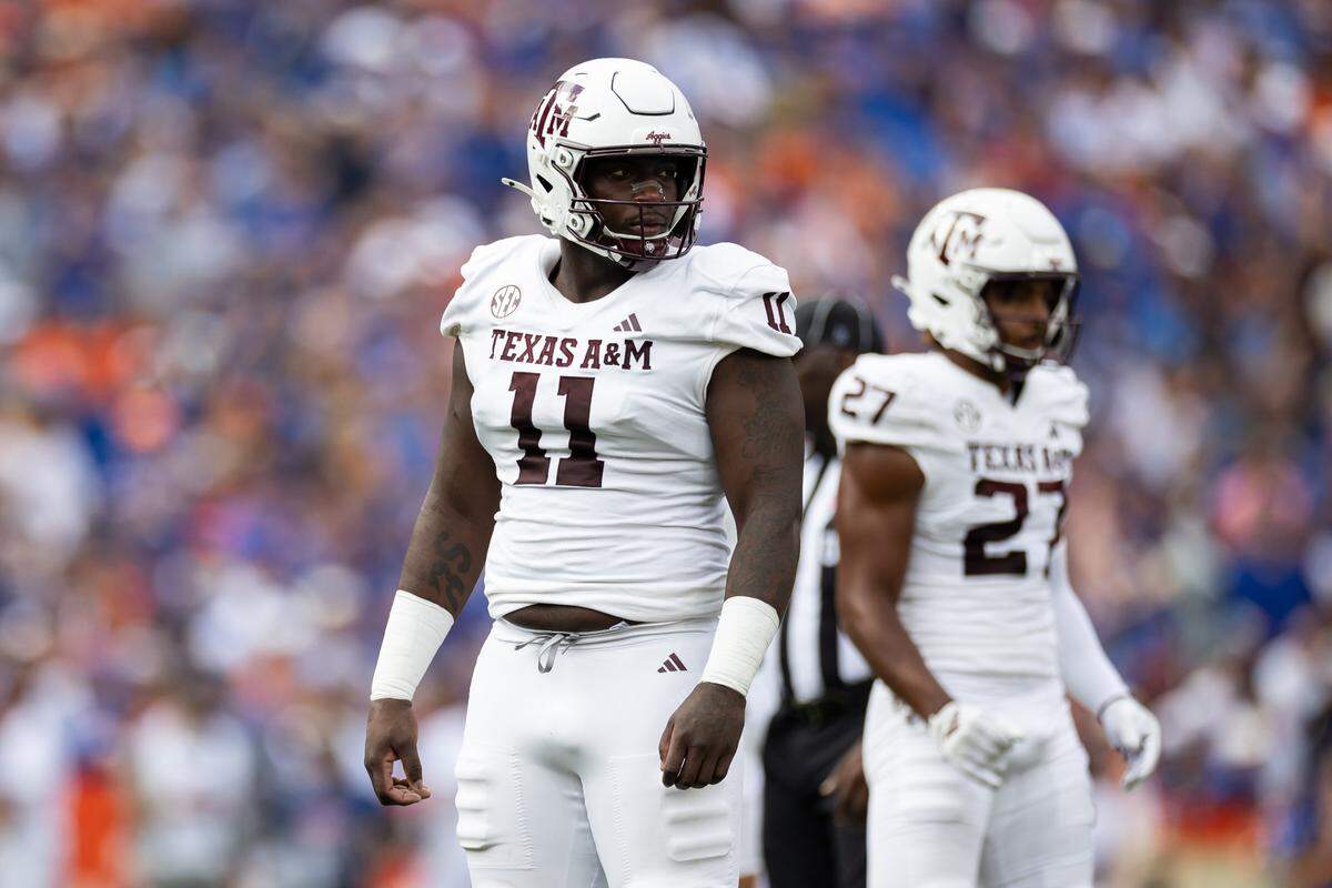 Texas A&M defensive lineman Nic Scourton (11) looks toward the sideline against the Florida Gators during a game last season at Ben Hill Griffin Stadium.