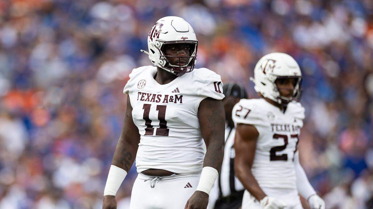 Texas A&M defensive lineman Nic Scourton (11) looks toward the sideline against the Florida Gators during a game last season at Ben Hill Griffin Stadium.