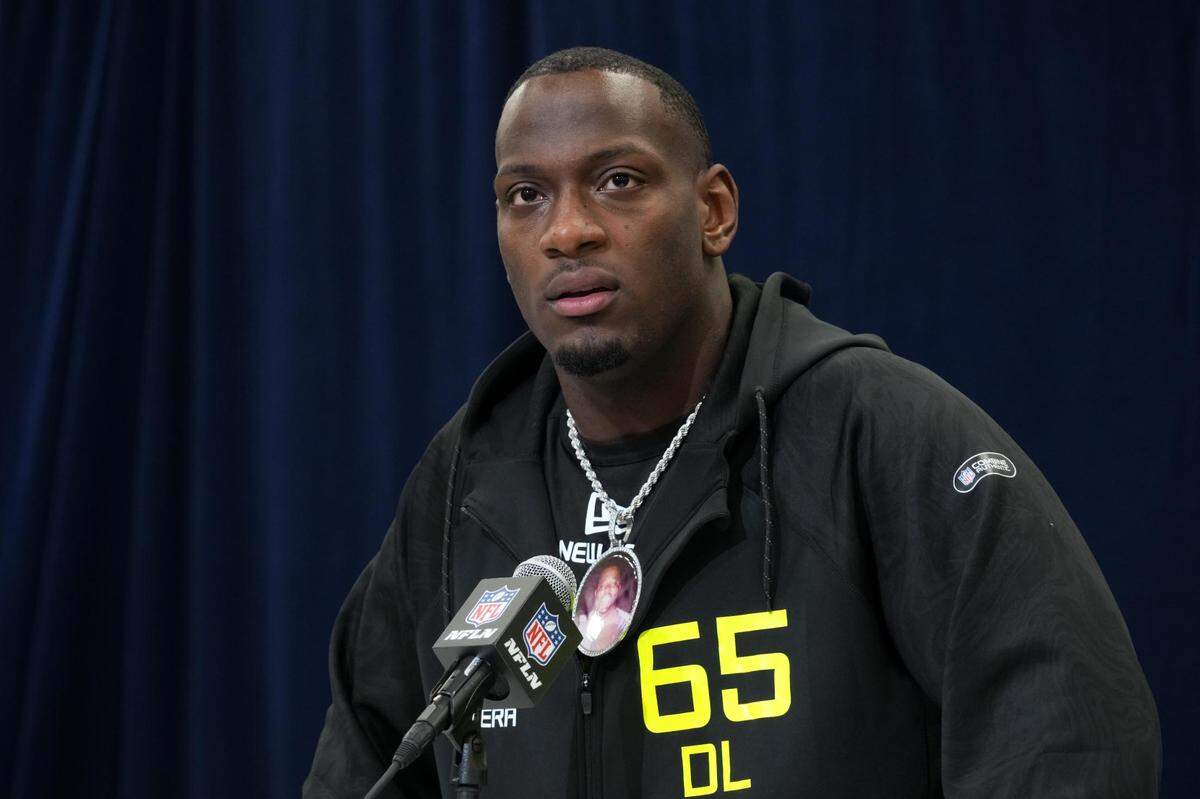Texas A&M defensive lineman Nic Scourton (DL65) wears a medallion with picture of late uncle, Harold, during the 2025 NFL Scouting Combine at the Indiana Convention Center.