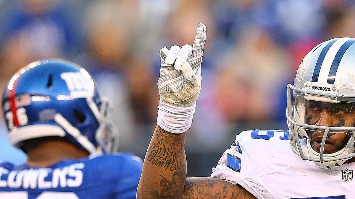 OCTOBER 25: Greg Hardy #76 of the Dallas Cowboys celebrates a sack during the second quarter against the New York Giants at MetLife Stadium on October 25, 2015 in East Rutherford, New Jersey. (Photo by Elsa/Getty Images)
