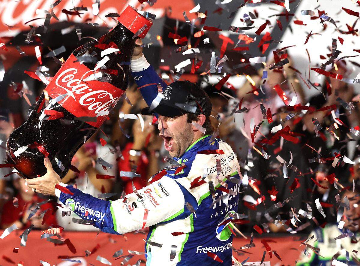 NASCAR driver Daniel Suarez celebrates winning the Coca-Cola 600 at Charlotte Motor Speedway in Concord, NC on Sunday, May 24, 2026. Suarez was declared the winner when the race was stopped due to rain.