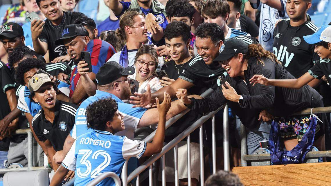 Charlotte FC Brian Romero, bottom left, celebrates with fans after a win against Chelsea at the Bank of America Stadium in Charlotte, N.C., on Wednesday, July 20, 2022. In many ways, he will be the face of Crown Legacy in the 2023 season.