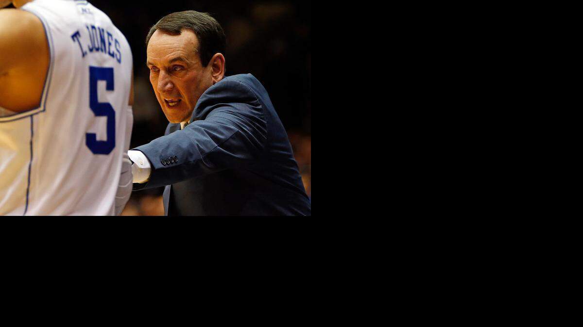 
Duke head coach Mike Krzyzewski gives instructions to Tyus Jones (5) during the second half of an NCAA college basketball game against Clemson, Saturday, Feb. 21, 2015, in Durham, N.C. Duke won 78-56. 
