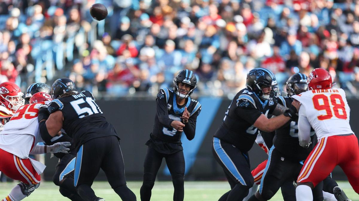 Panthers quarterback Bryce Young, center, throws a pass as the offensive line creates a hole during the game against the Chiefs at Bank of America Stadium in Charlotte, NC on Sunday, Nov. 24, 2024.