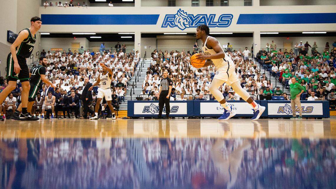 AJ McKee initiates the offense against Marshall in Queens’ first home men’s basketball game as a Division I program on Nov. 7, 2022 in the Levine Center.
