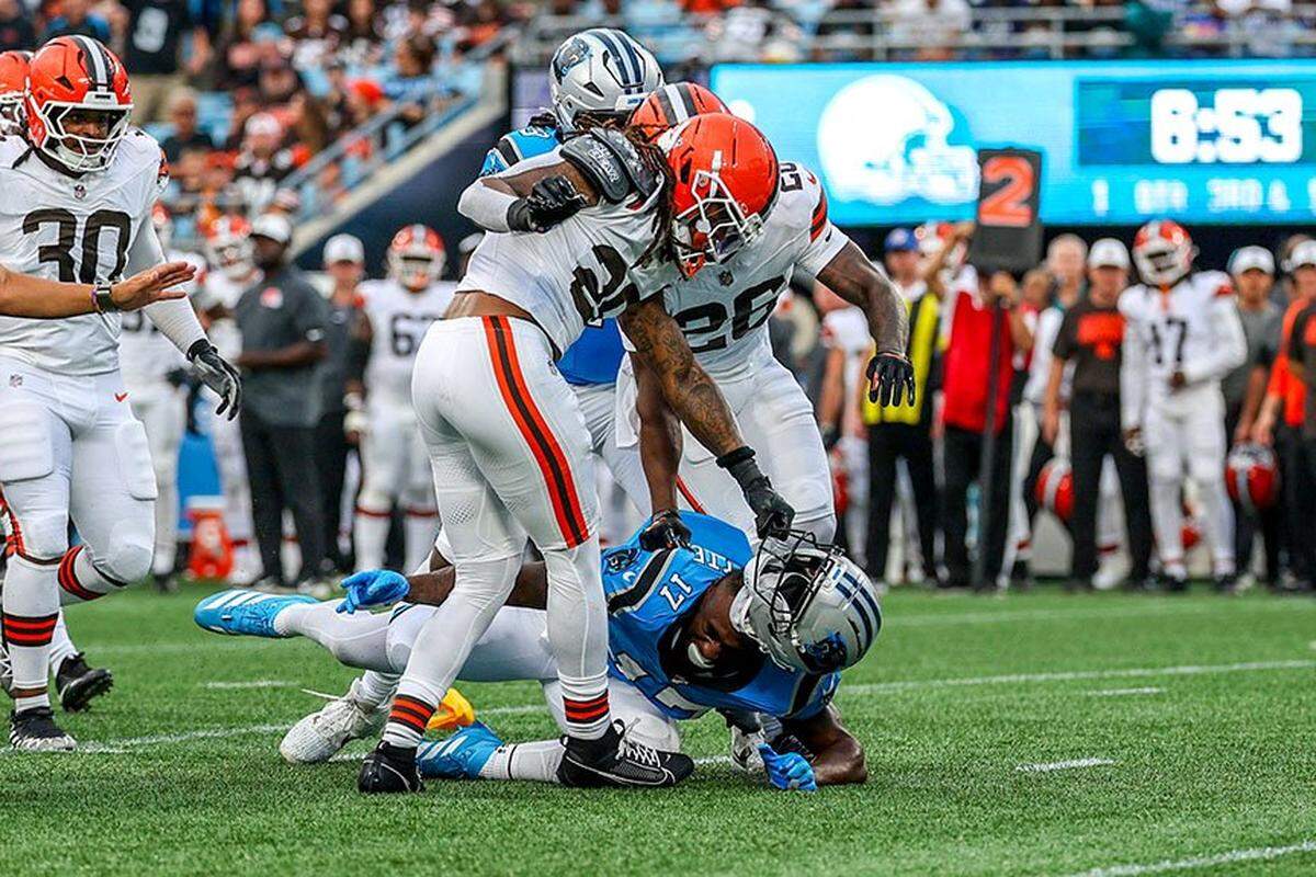 Cleveland Browns safety Rayshawn Jenkins tears the helmet off of Carolina Panthers wide receiver Xavier Legette during their preseason game at The Bank of America Stadium in Charlotte, NC, Friday August 8, 2025. 