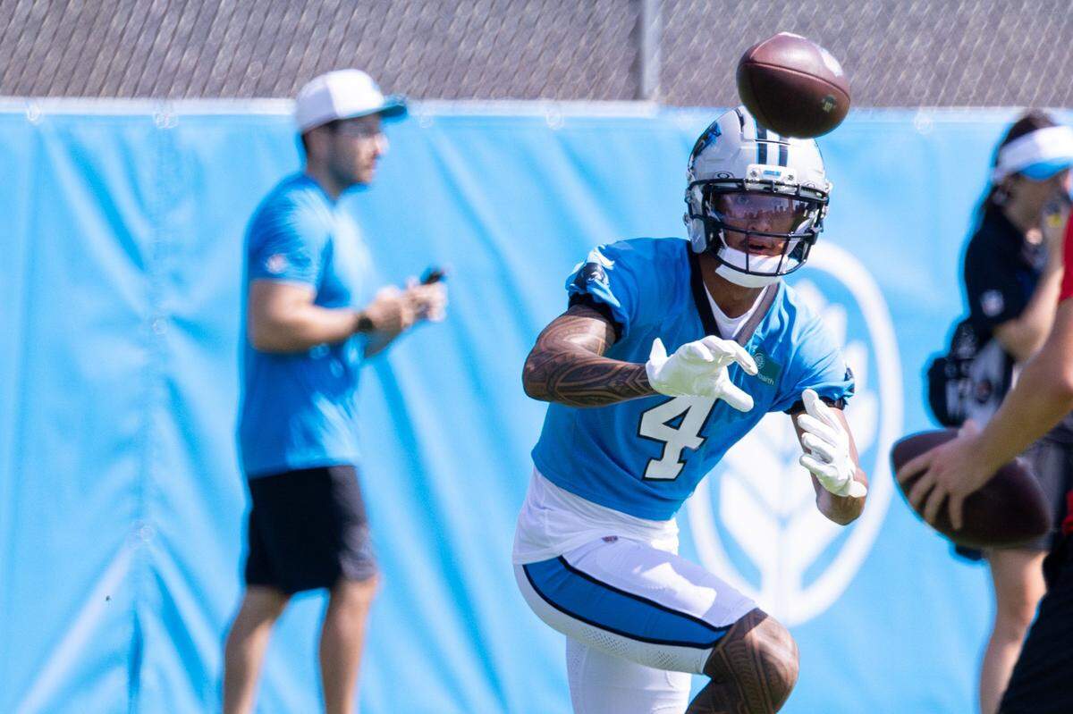 Carolina Panthers wide receiver Tetairoa McMillan catches a pass during July training camp.