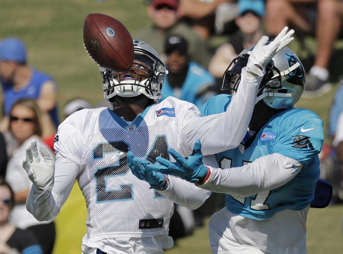 Carolina Panthers’ James Bradberry (24) defends against Devin Funchess (17) during an NFL football practice at the team’s training camp in Spartanburg, S.C., Saturday, July 28, 2018. (AP Photo/Chuck Burton)