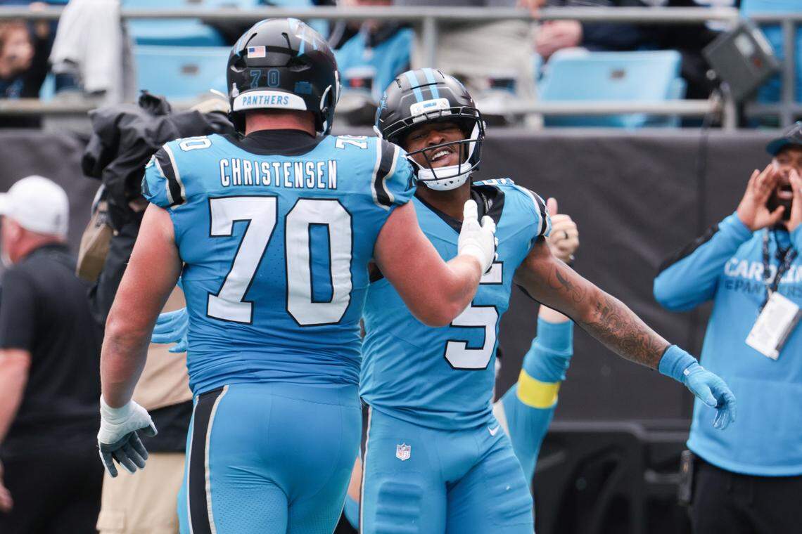 Carolina Panthers running back Rico Dowdle (5) celebrates a touchdown with offensive tackle Brady Christensen (70) during Sunday’s second half against the Dallas Cowboys at Bank of America Stadium. The Panthers won, 30-27, to improve their record to 3-3. Dallas dropped to 2-3-1.