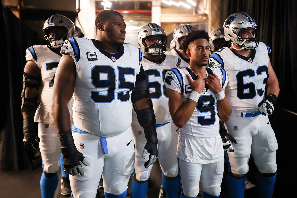 NEW ORLEANS, LOUISIANA - DECEMBER 14: Derrick Brown #95, Bryce Young #9, Austin Corbett #63 of the Carolina Panthers wait in the tunnel prior to the game against the New Orleans Saints at Caesars Superdome on December 14, 2025 in New Orleans, Louisiana. (Photo by Chris Graythen/Getty Images)