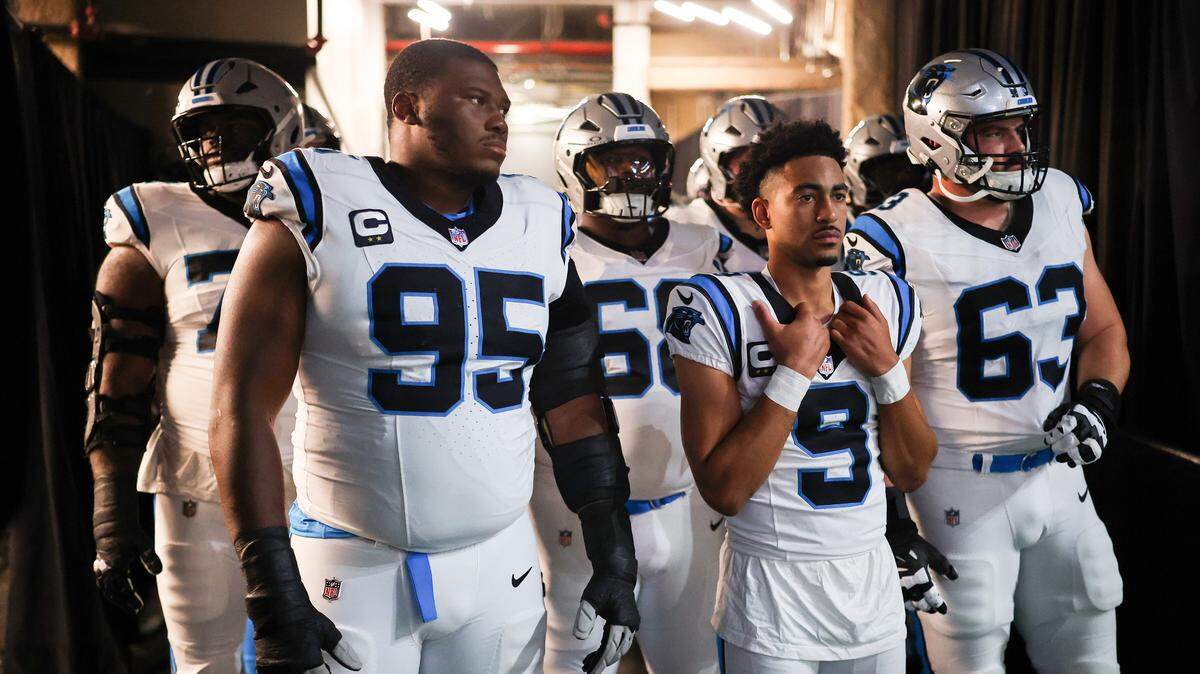 NEW ORLEANS, LOUISIANA - DECEMBER 14: Derrick Brown #95, Bryce Young #9, Austin Corbett #63 of the Carolina Panthers wait in the tunnel prior to the game against the New Orleans Saints at Caesars Superdome on December 14, 2025 in New Orleans, Louisiana. (Photo by Chris Graythen/Getty Images)