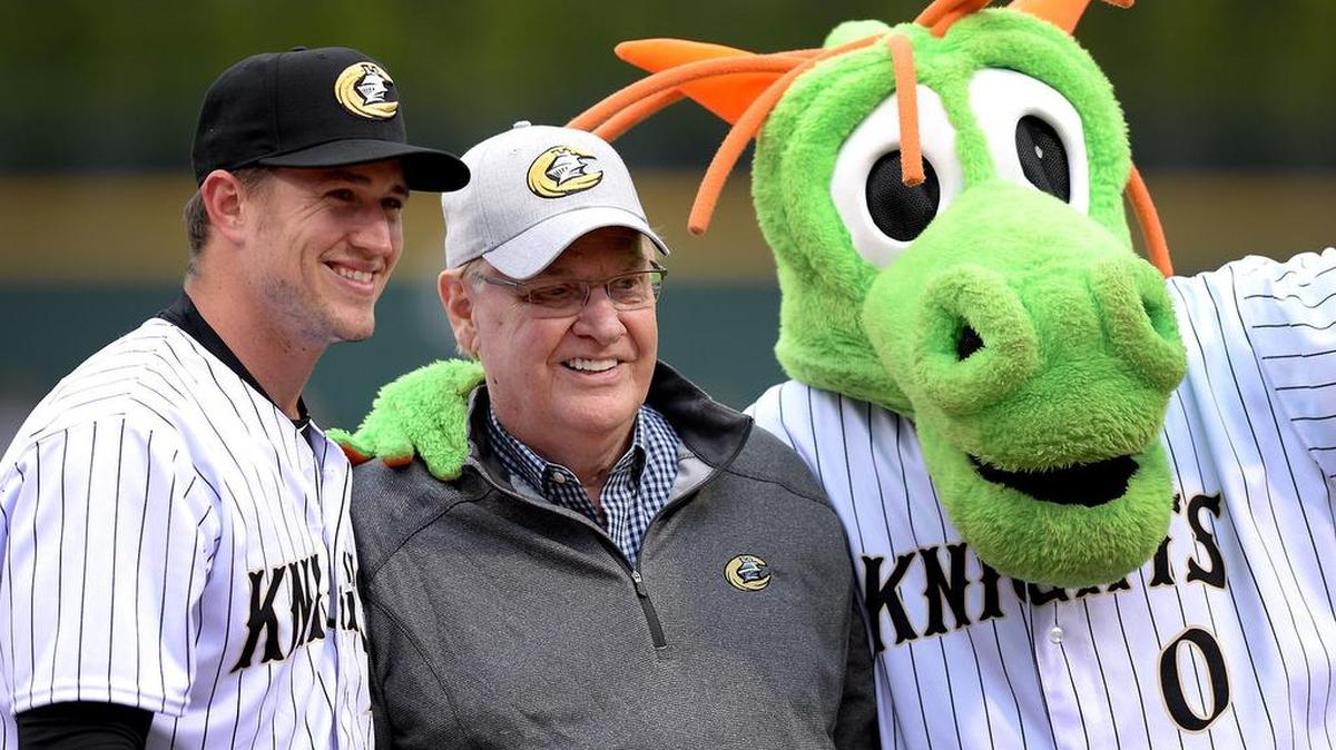 Charlotte Knights Carson Fulmer, left, owner Don Beaver, center and team mascot Homer pose for a photograph after Beaver threw out the first pitch to open the season on Thursday, April 4, 2019 in Charlotte, NC. The Knights hosted the Bulls in the season opener.