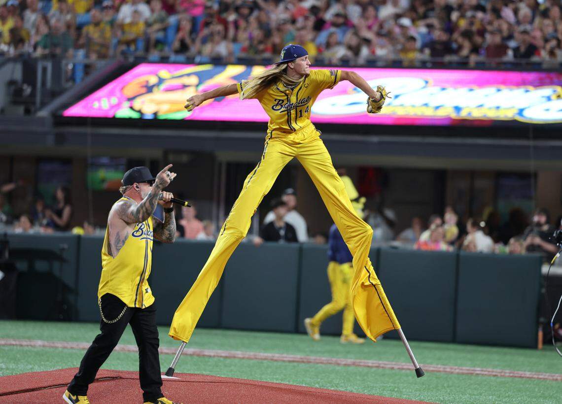 Bananas’ Dakota Albritton piches on stilts while country music artist Brantley Gilbert performs Friday, June 6, 2025 at Bank of America Stadium in Charlotte