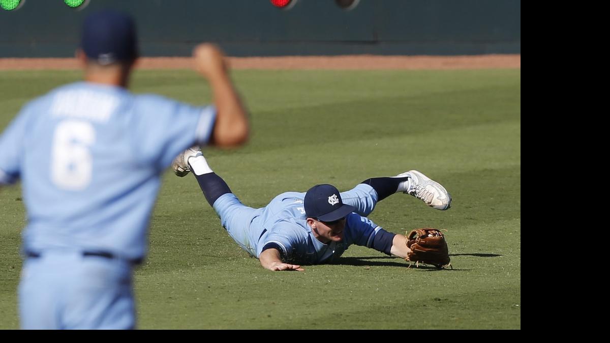 
North Carolina's Adam Pate (2) makes a diving catch of a ball hit by Clemson's Tyler Slaton  in the seventh inning during UNC's 6-3 victory over Clemson in the ACC Baseball Tournament at the Durham Bulls Athletic Park in Durham.
