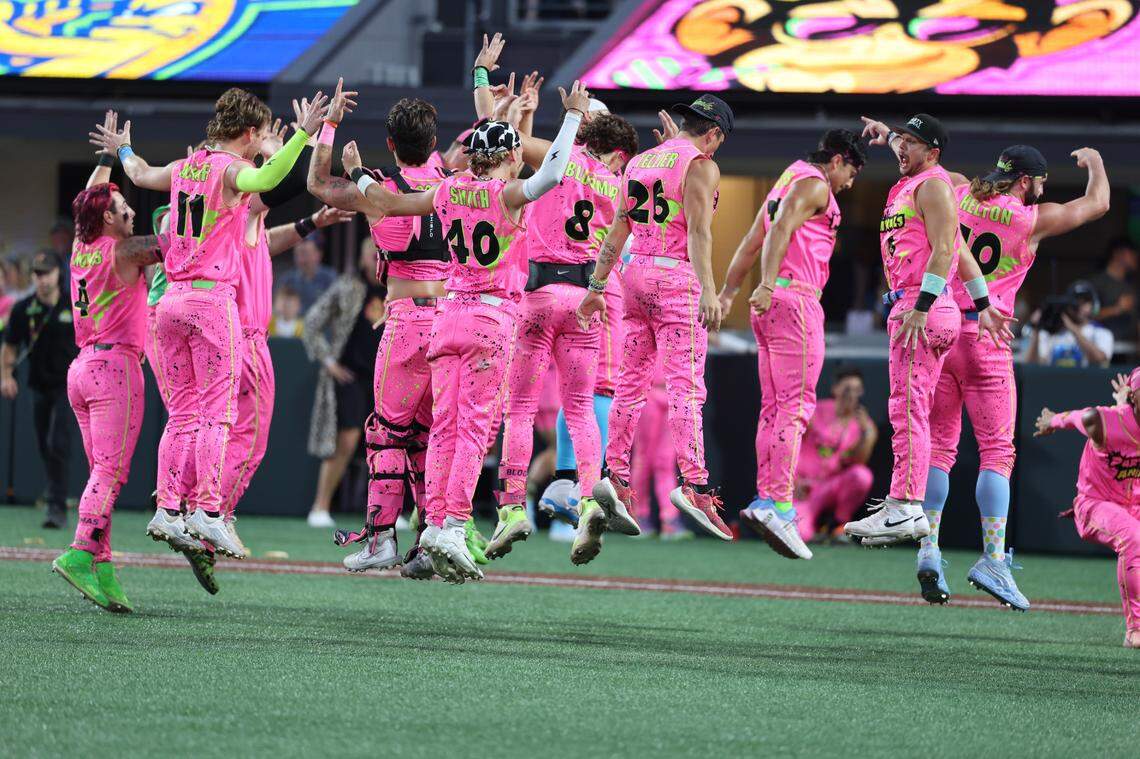 The Party Animals leap into the air after scoring a run Friday, June 6, 2025 at Banana Ball at Bank of America Stadium in Charlotte