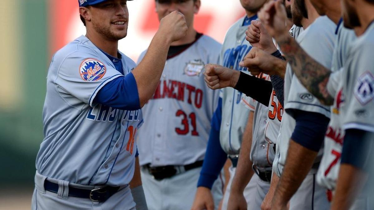 Las Vegas 51s Travis Taijeron, left, bumps fists with his Pacific Coast League All-Stars after being introduced during Wednesday’s 2016 Triple-A All-Star Game at BB&T Ballpark in Charlotte. Taijeron and Pawtucket's Chris Marrero won the game's Top Star Award for the Pacific Coast League and International Leagues.