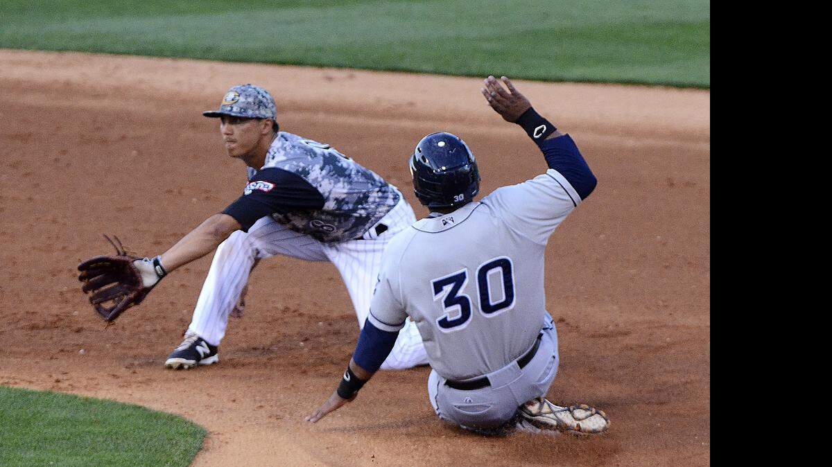 
Tyler Saladino, #8, waits for the ball after a wild pitch by Erik Johnson, the Knights pitcher. The Clippers Jesus Aguilar, #30, was safe at second in the third inning. 
