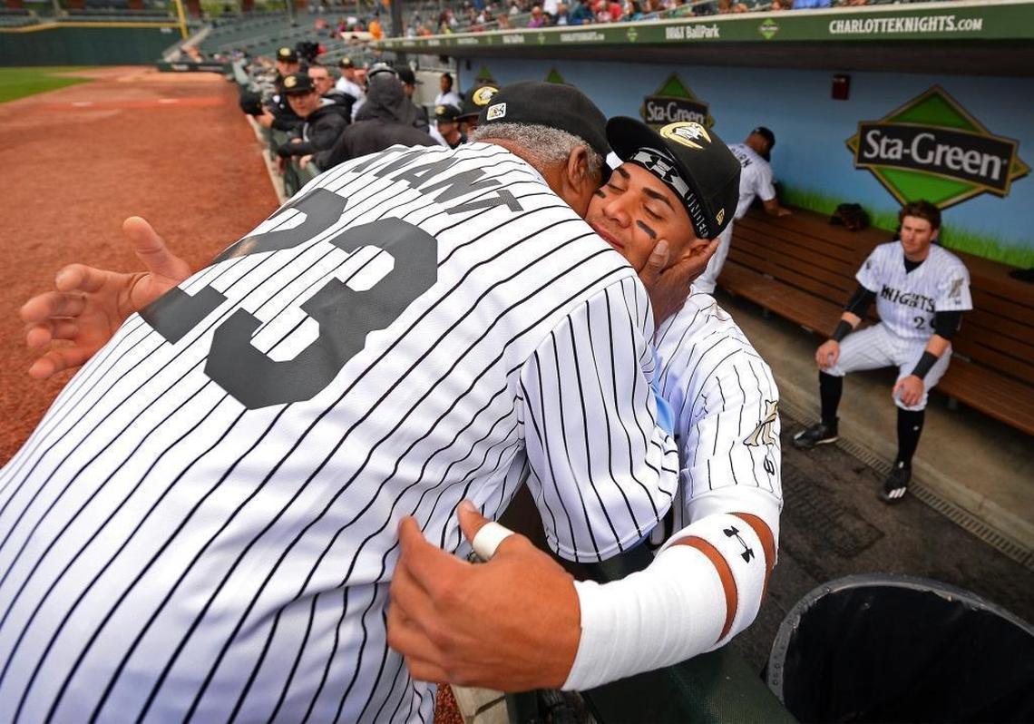 Former Major League Baseball great Luis Tiant, left, played an crucial role in his former club, the Boston Red Sox, signing second baseman Yoan Moncada, now with the Charlotte Knights, to a contract that included a record $31.5 million signing bonus in February 2015.