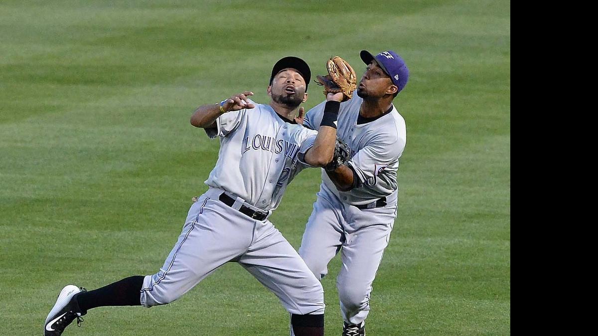 
 Louisville's outfielder Yorman Rodriguez on left, collides with infielder Eugenio Suarez right, Suarez caught the ball for the out, during tonight's game played against Louisville at BB&T Ballpark May 11,2015.
