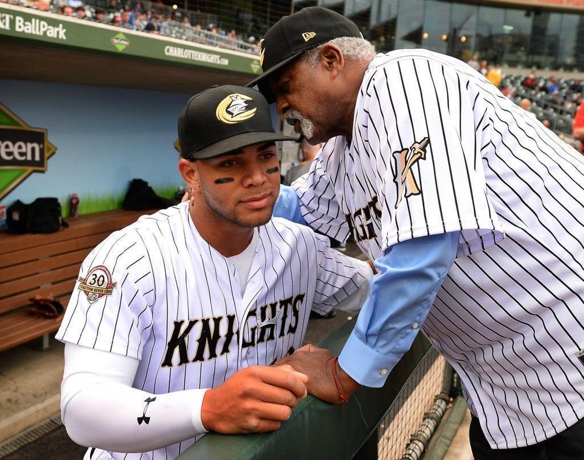 For today’s players, such as Charlotte Knights second baseman Yoan Moncada, left, the blueprint for thriving in the U.S. has been established by former Major League Baseball great Luis Tiant, right, and other Cuban greats.