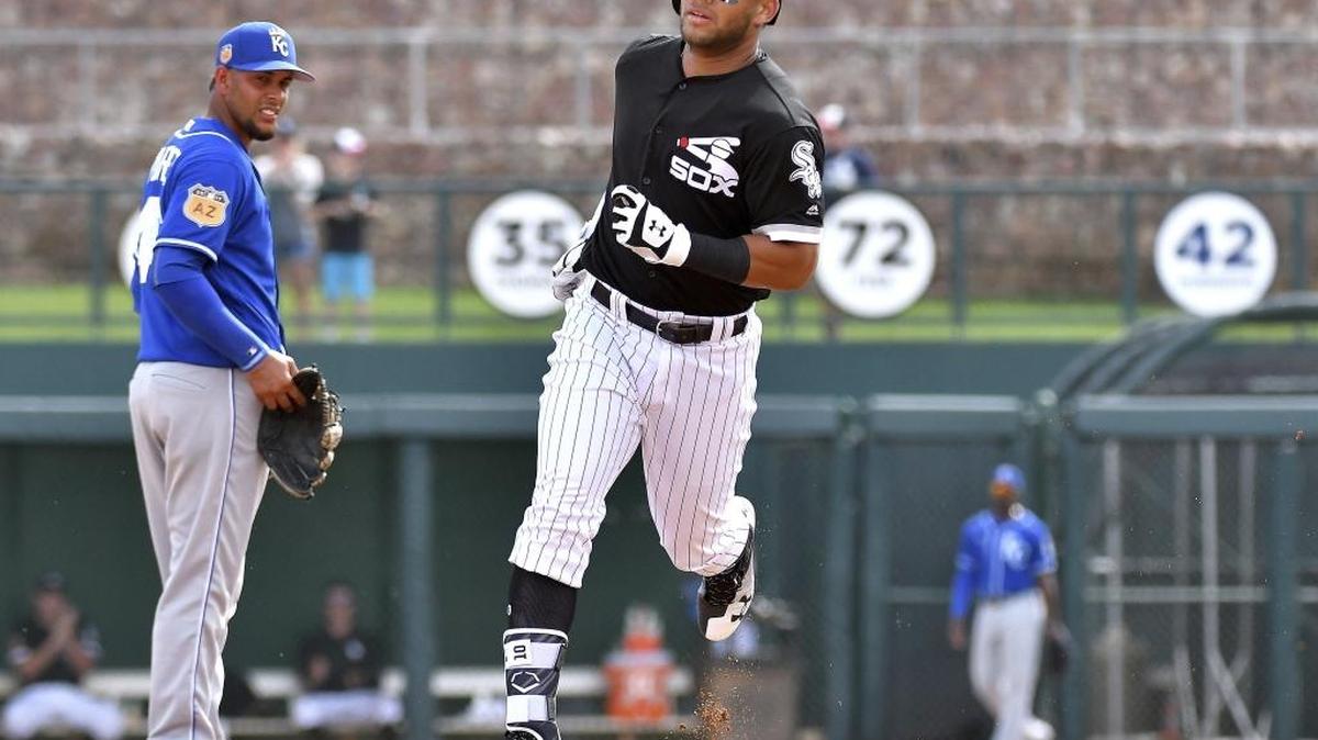 Chicago White Sox prospect Yoan Moncada rounds the bases past Kansas City Royals third baseman Ramon Torres after a two-run homer in the fifth inning of a spring training baseball game last Wednesday in Glendale, Ariz.