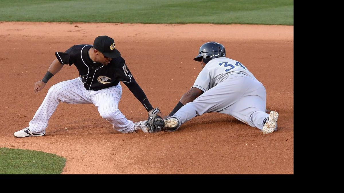 
Columbus Clippers runner Carlos Moncrief on right, makes it safe to second base, Charlotte Knights infielder Micah Johnson on left, makes the tag too late during Wednesday night's game played at BB&T Ballpark May 27,2015.
