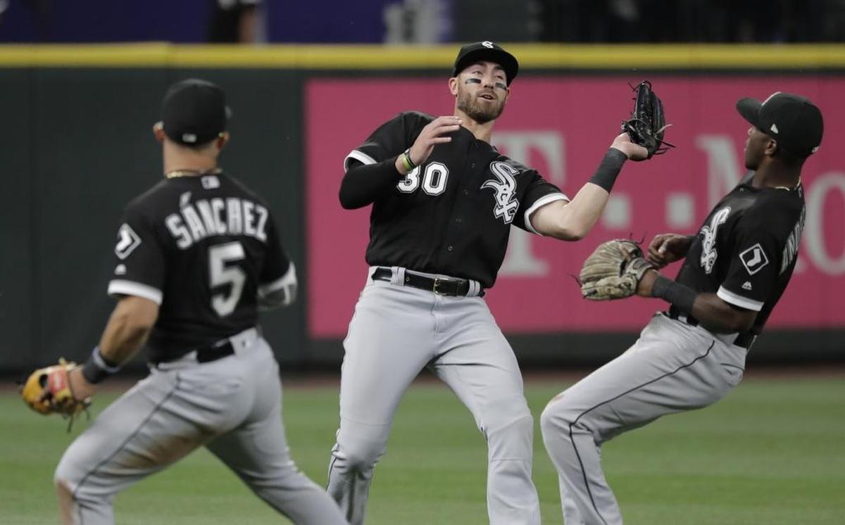 Chicago White Sox left fielder Nicky Delmonico had three hits in an injury rehab appearance in Charlotte on Monday. Above, Delmonico, center, makes a catch for Chicago during Friday’s game at Seattle.