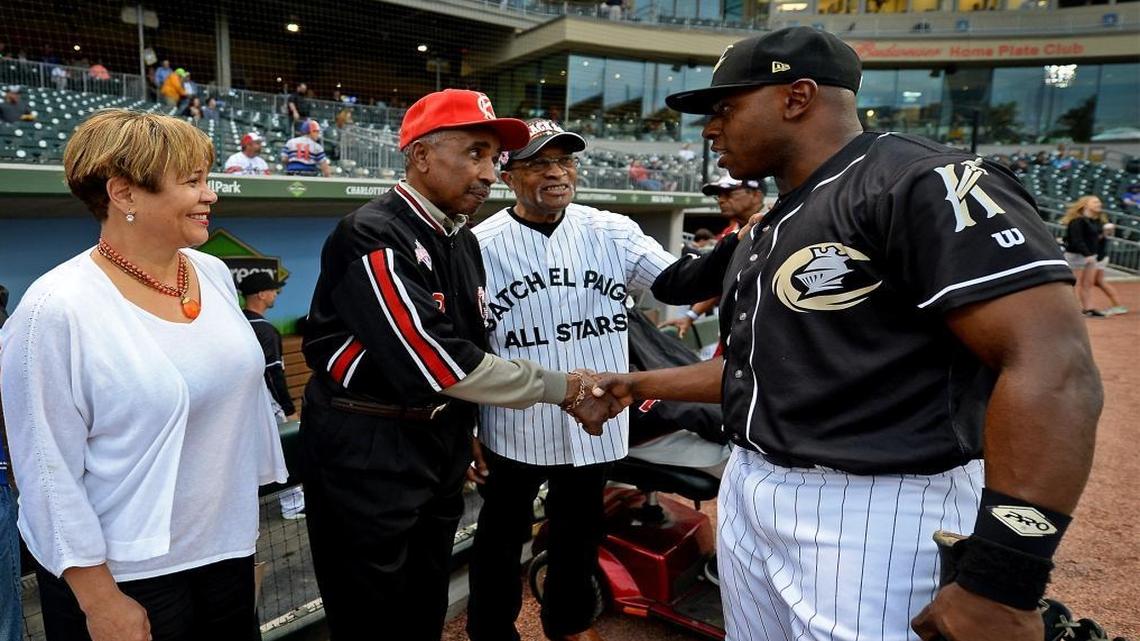 Charlotte Mayor Pro Tem Vi Lyles, from left, Sam Allen and Luther "Luke" Atkinson, right, meet Charlotte Knights outfielder Jason Bourgeois before an April 17 game at BB&T BallPark. The Knights were celebrating the memory of Jackie Robinson, who broke baseball’s color barrier 70 years ago, and several former Negro League players were on hand.
