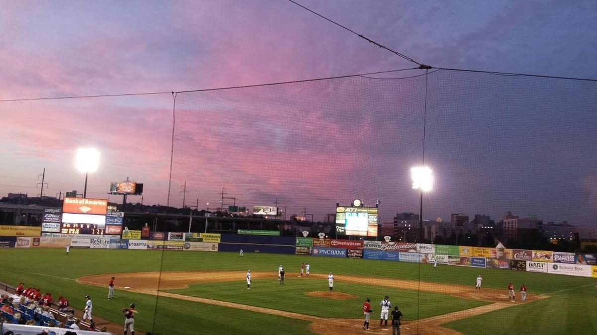 The sun sets behind Frawley Stadium off I-95 in Wilmington, Del., on Aug. 12, 2015.