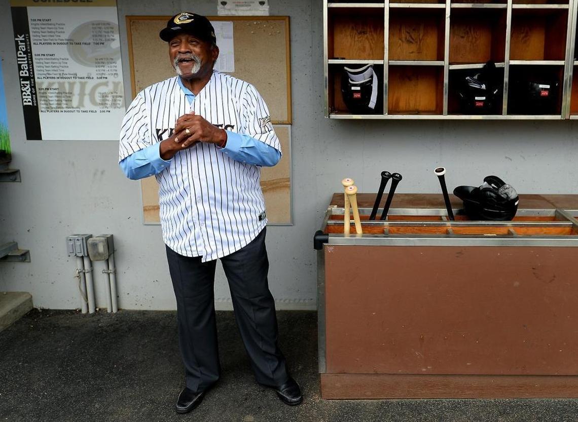 Former Major League Baseball great Luis Tiant waits in the Charlotte Knights dugout prior to throwing out the ceremonial first pitch during his visit to BB&T BallPark on Wednesday.