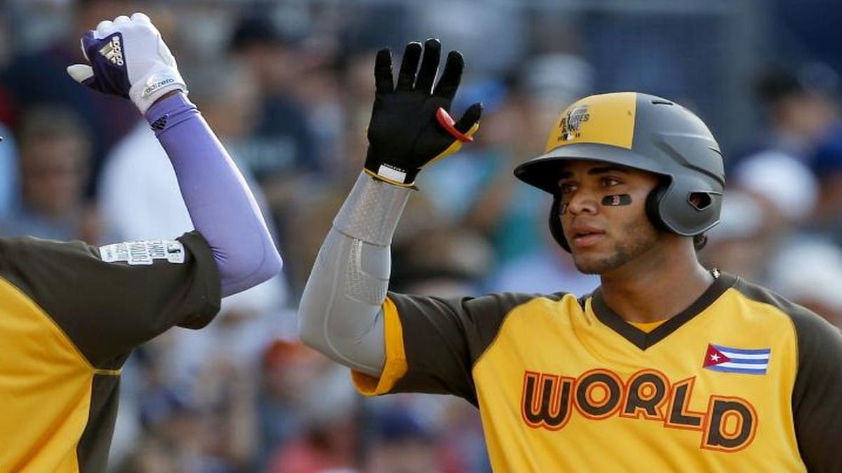 Yoan Moncada (right), baseball’s No. 1 prospect, could spend time in Charlotte after being traded to the White Sox organization, whose Class AAA affiliate is the Knights. Moncada was part of a trade with the Boston Red Sox.