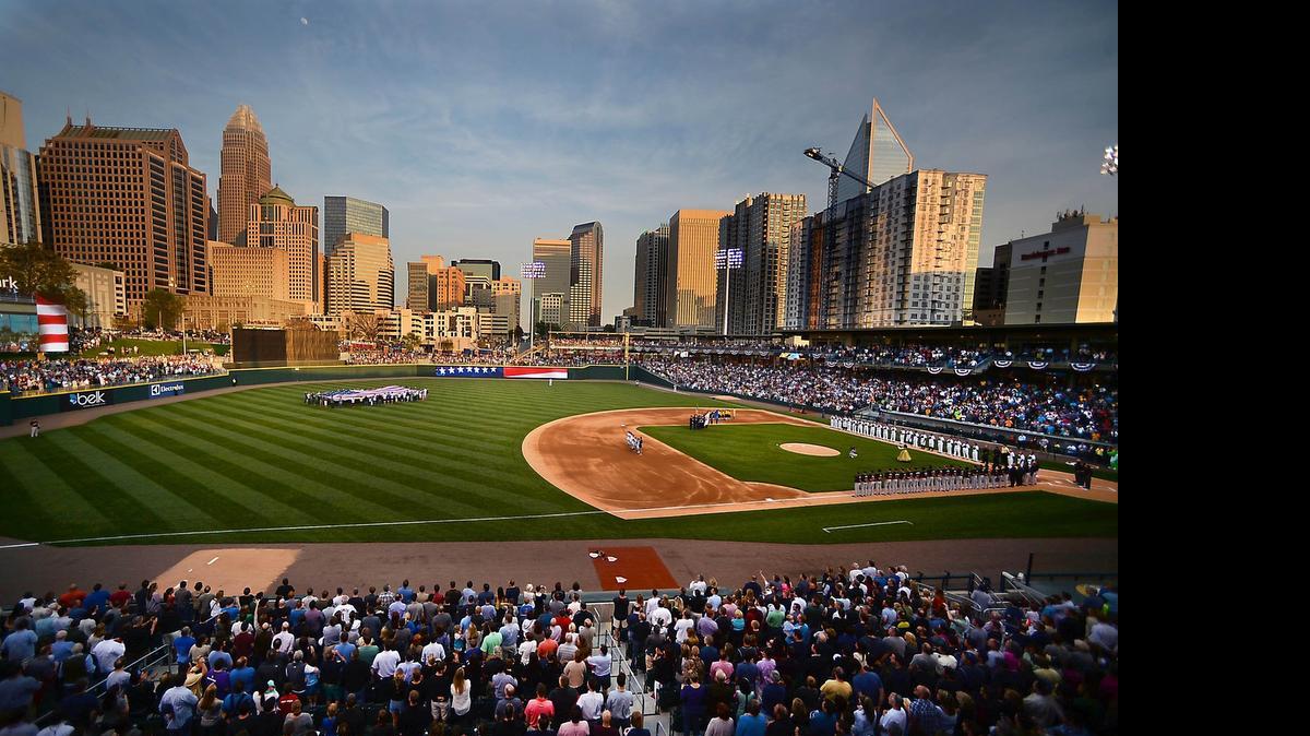 
April 11, 2014: Players take to the field for the National Anthem during the Knights home opener at BB&T Ballpark in uptown Charlotte. 
