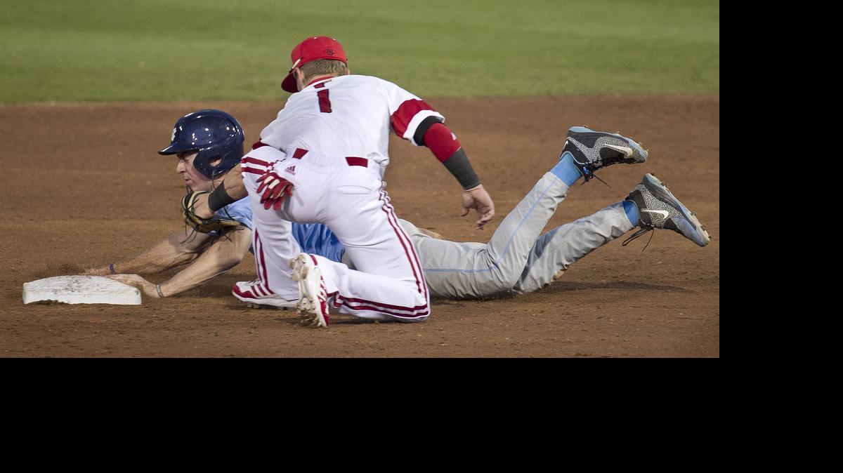 
Louisville second baseman Sutton Whiting (1) tags UNC’s Brian Millertrying to steal second base in the third inning Wednesday.



