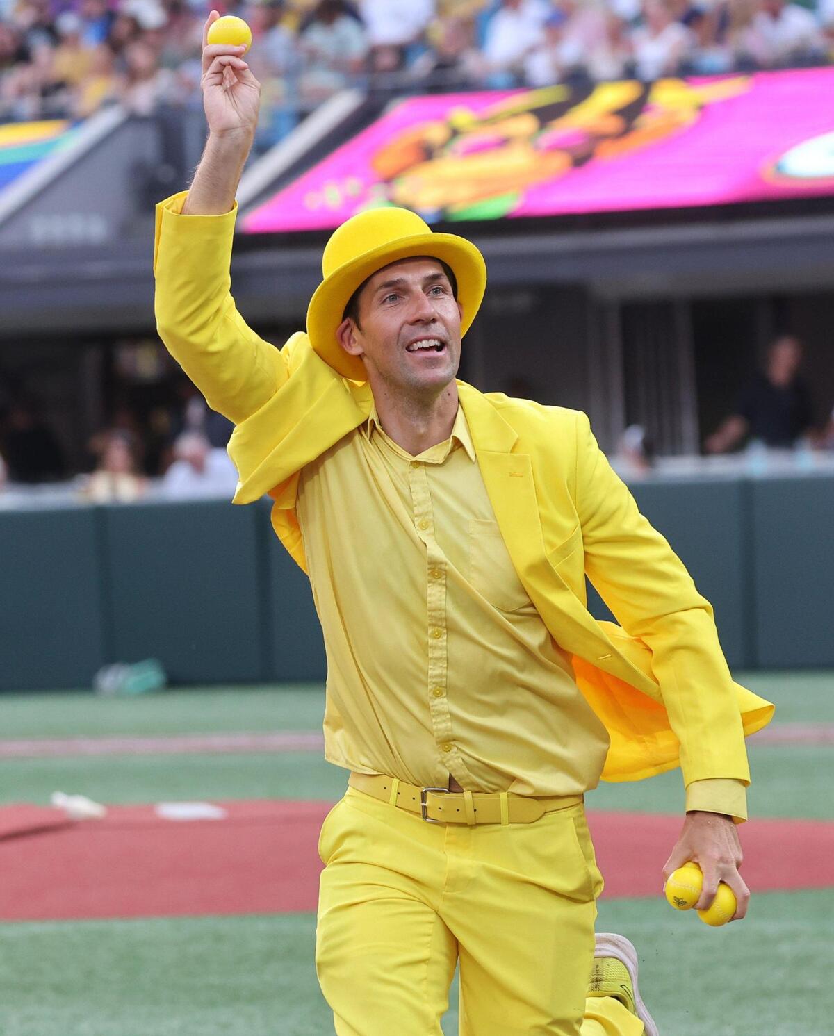 Savannah Bananas owner Jesse Cole throws out balls to the crowd Saturday, June 7, 2025 during Banana Ball at Bank of America Stadium in Charlotte