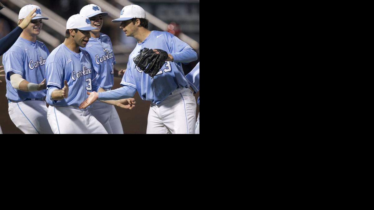 
North Carolina pitcher Zac Gallen, right, is congratulated by his teammates, including Jack Geraghty, center, after pitching a complete game in the Tar Heels’ 2-1 win over N.C. State on Friday at Boshamer Stadium in Chapel Hill,.
